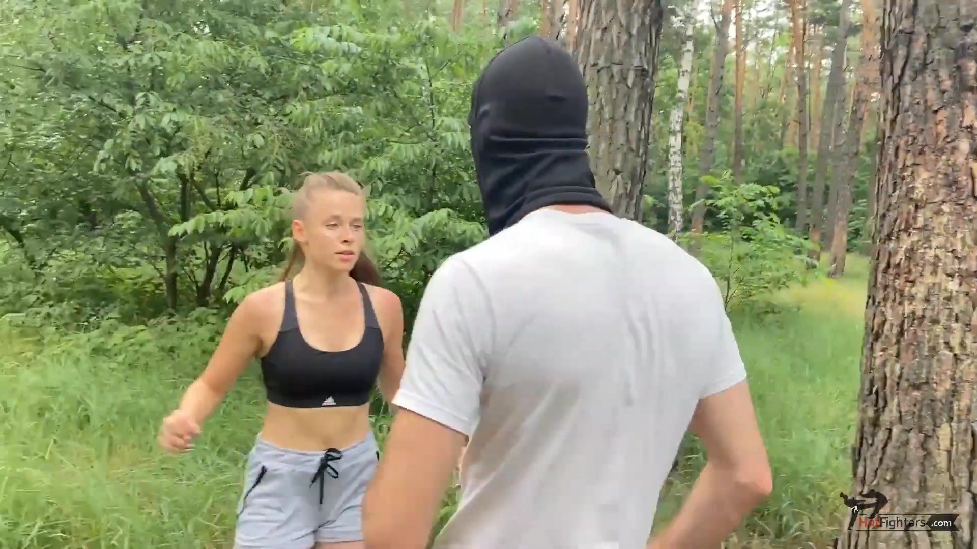 Cute karate girl running in the park 